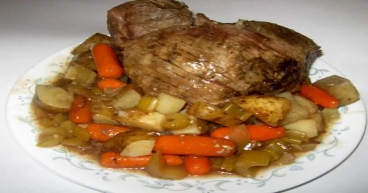 slow cooker top round roast with potatoes and carrots