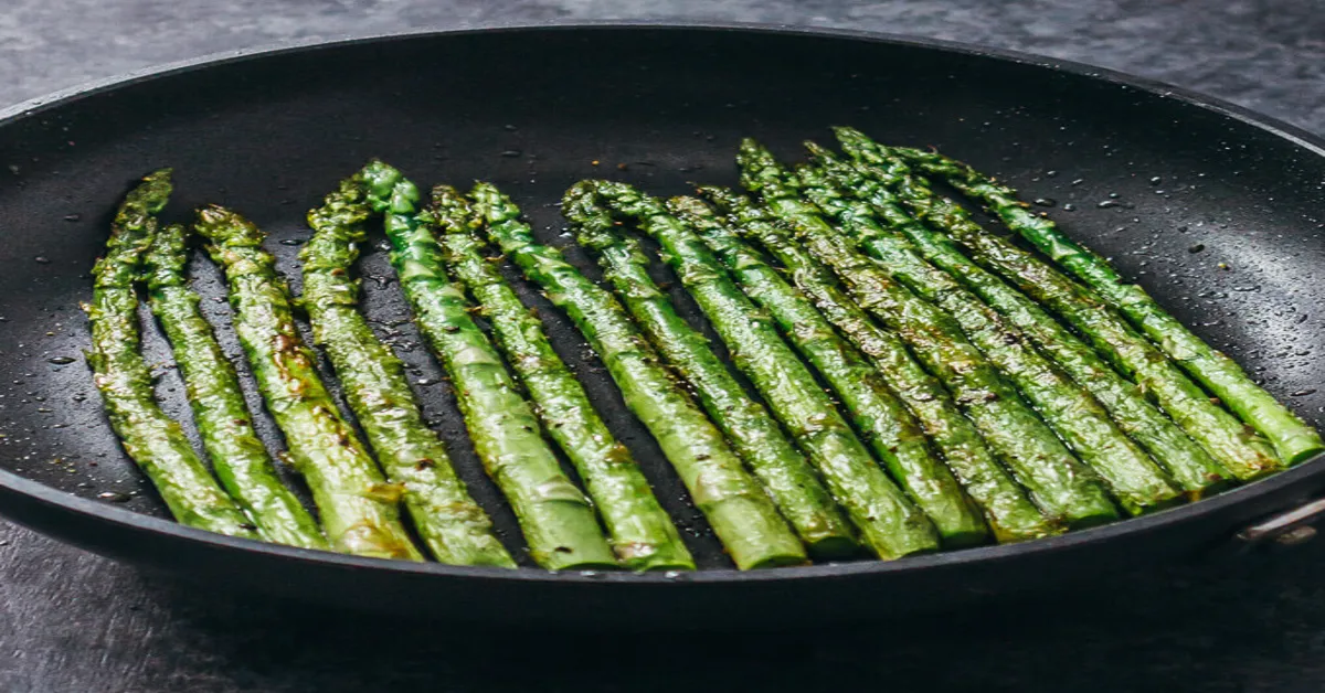 cooking asparagus on flat top grill