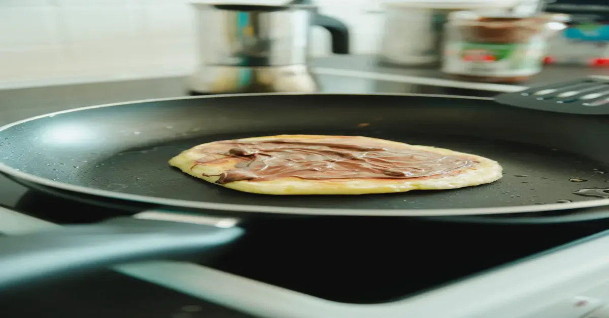 why does cooking spray ruin pans